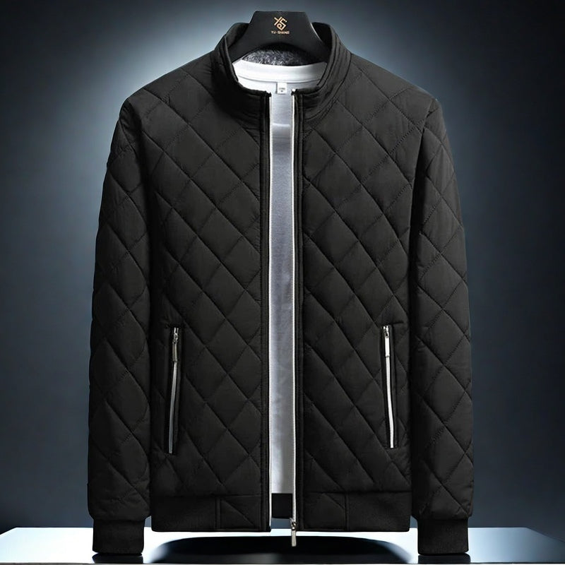 A quilted fleece jacket with a diamond pattern, featuring a collar, zippered pockets, and a slim-fit cut.