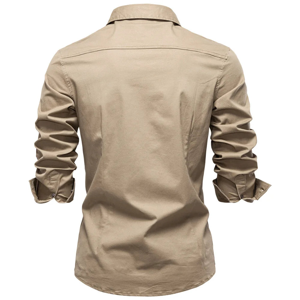 Beige shirt with rolled-up sleeves on a white background