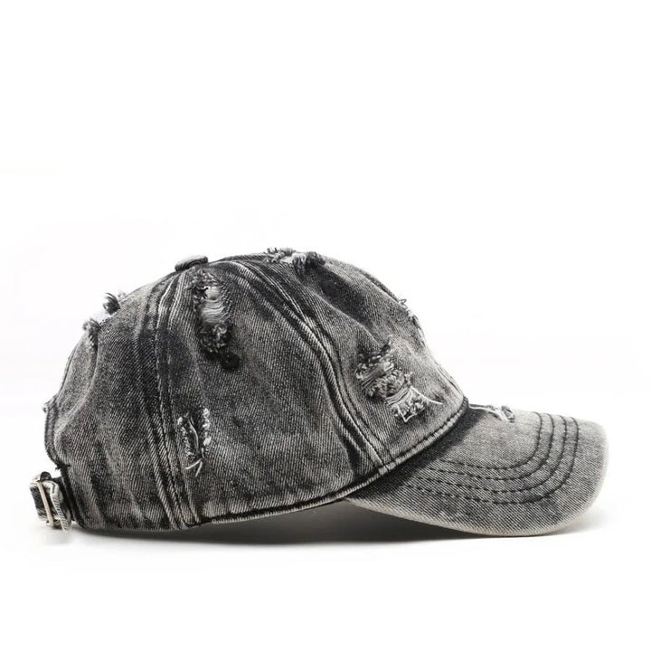 Distressed black baseball cap on a white background