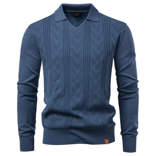 Blue cable knit sweater on a white background
