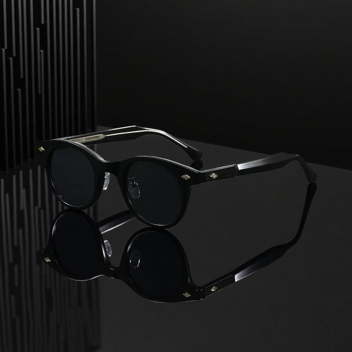 Black sunglasses with reflective surface on a dark background