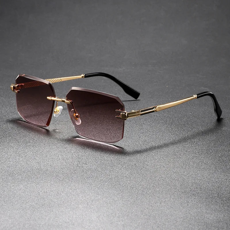 Sunglasses with gold frames and dark lenses on a gray background