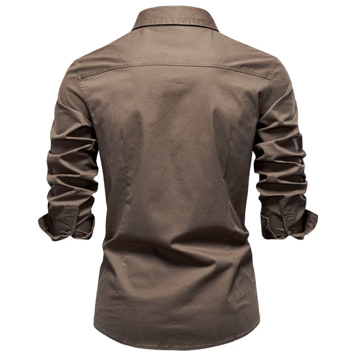 Brown shirt with rolled-up sleeves on a white background