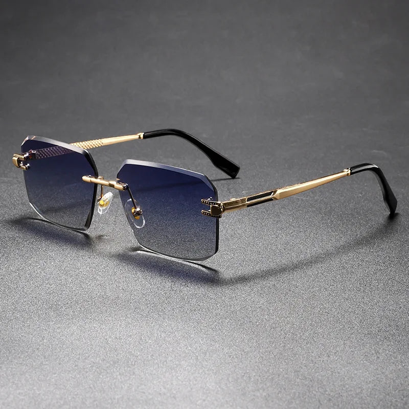 Sunglasses with gold frames and blue gradient lenses on a gray background