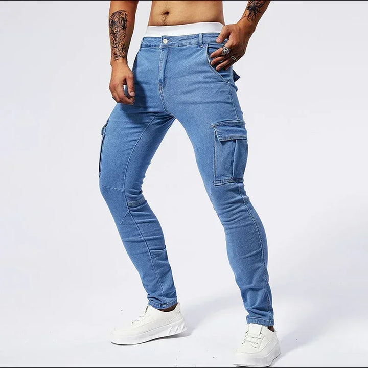 Person wearing light blue cargo jeans on a white background