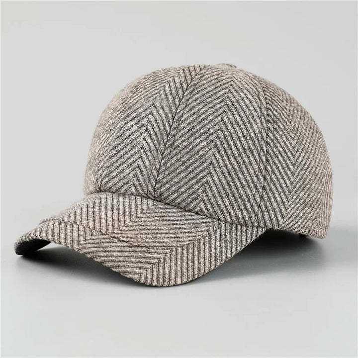 Herringbone patterned cap on a light gray background