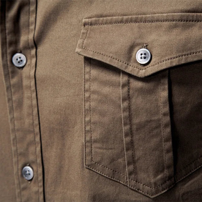 Close-up of a brown shirt with a pocket and buttons
