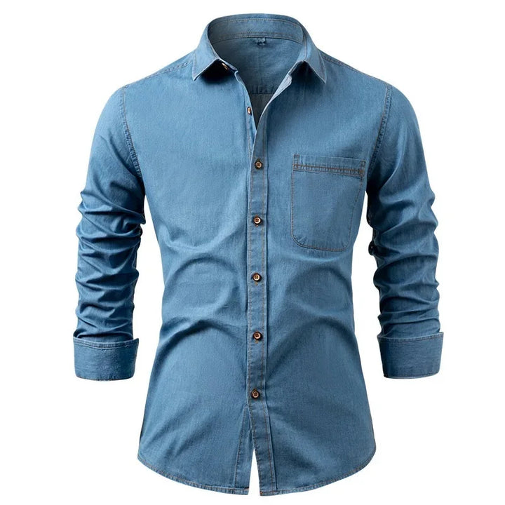 Blue denim shirt with rolled-up sleeves on a white background