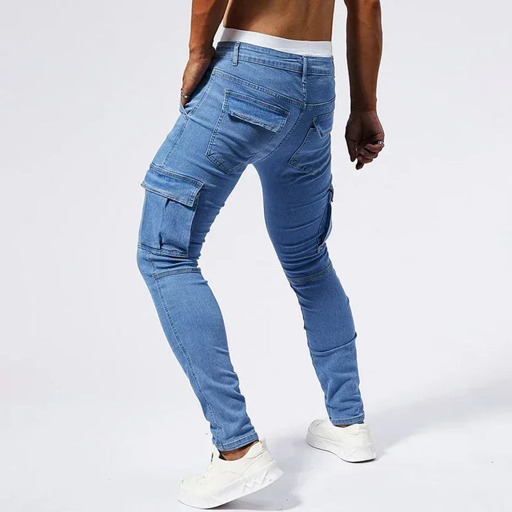 Blue jeans worn by a person on a white background