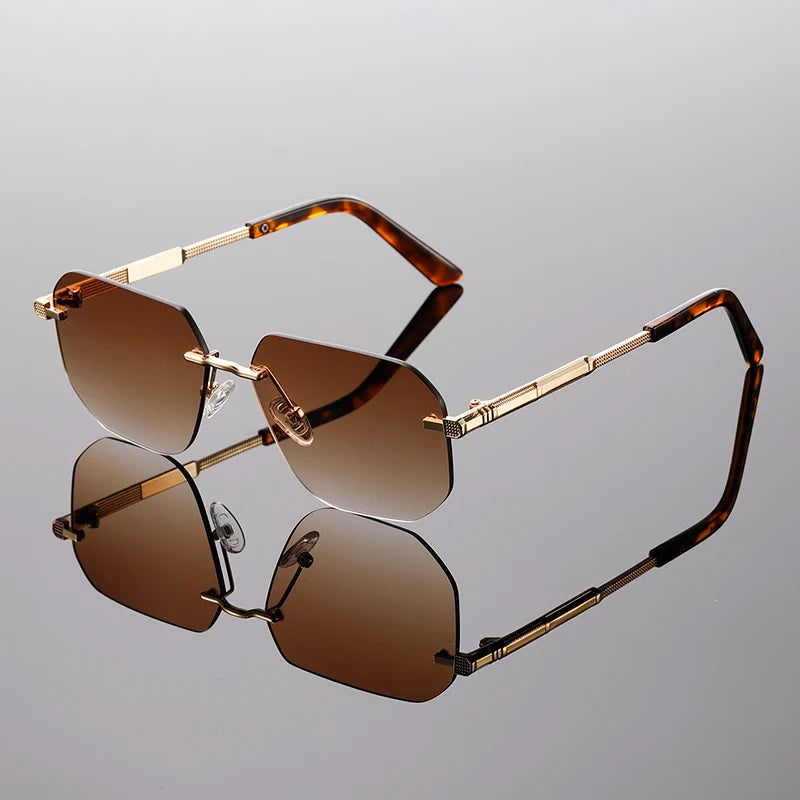 Sunglasses with gold frames and brown lenses on a gray background
