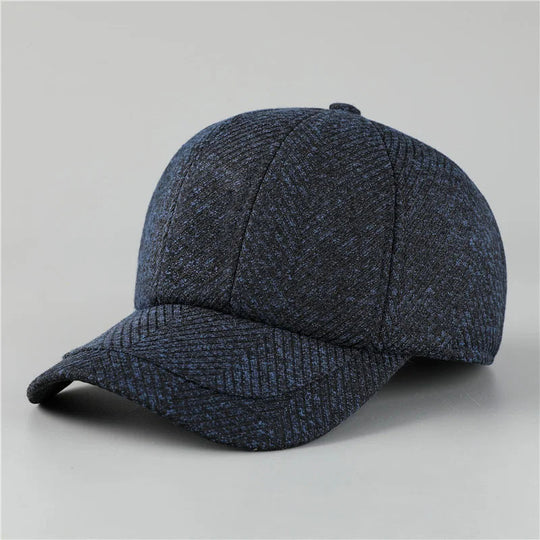 Blue textured baseball cap on a light gray background