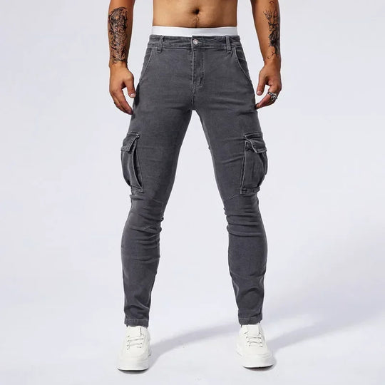 Person wearing gray cargo pants on a white background