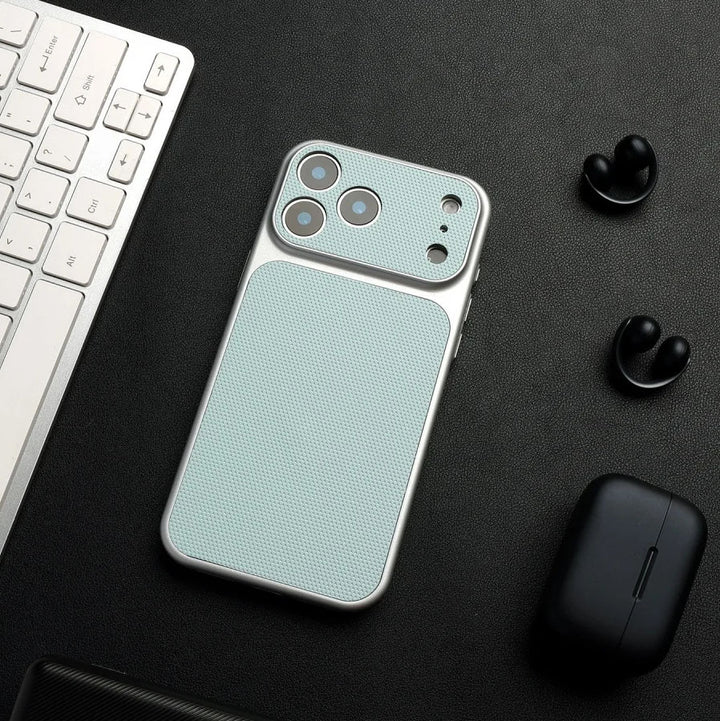 Phone case with textured design on a black surface with keyboard and earbuds