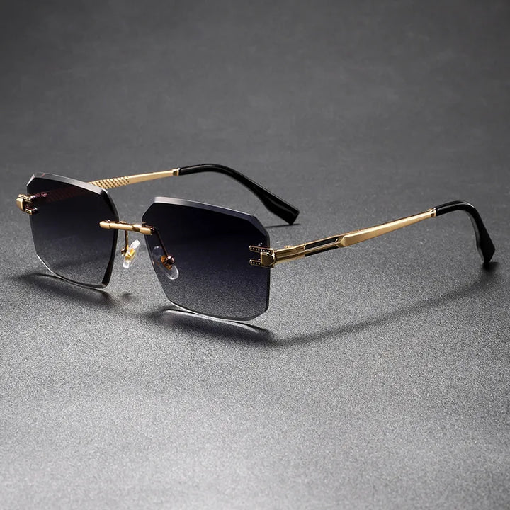 Gold-framed sunglasses with black lenses on a gray background