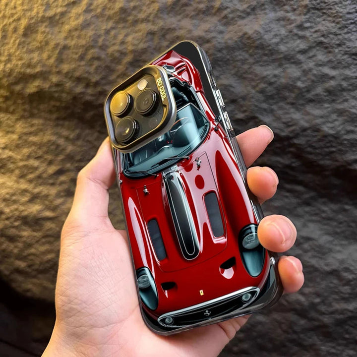 Phone case designed like a red sports car held in a hand against a textured background