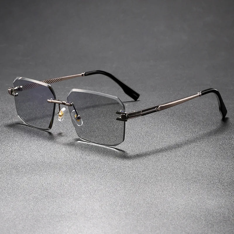 Sleek, rimless eyeglasses on a gray background