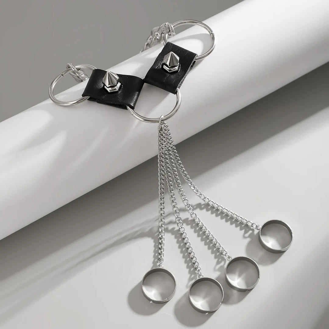 Black leather bracelet with silver chain and measuring cups on a white background