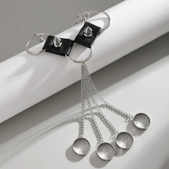 Black leather bracelet with silver chain and measuring cups on a white background