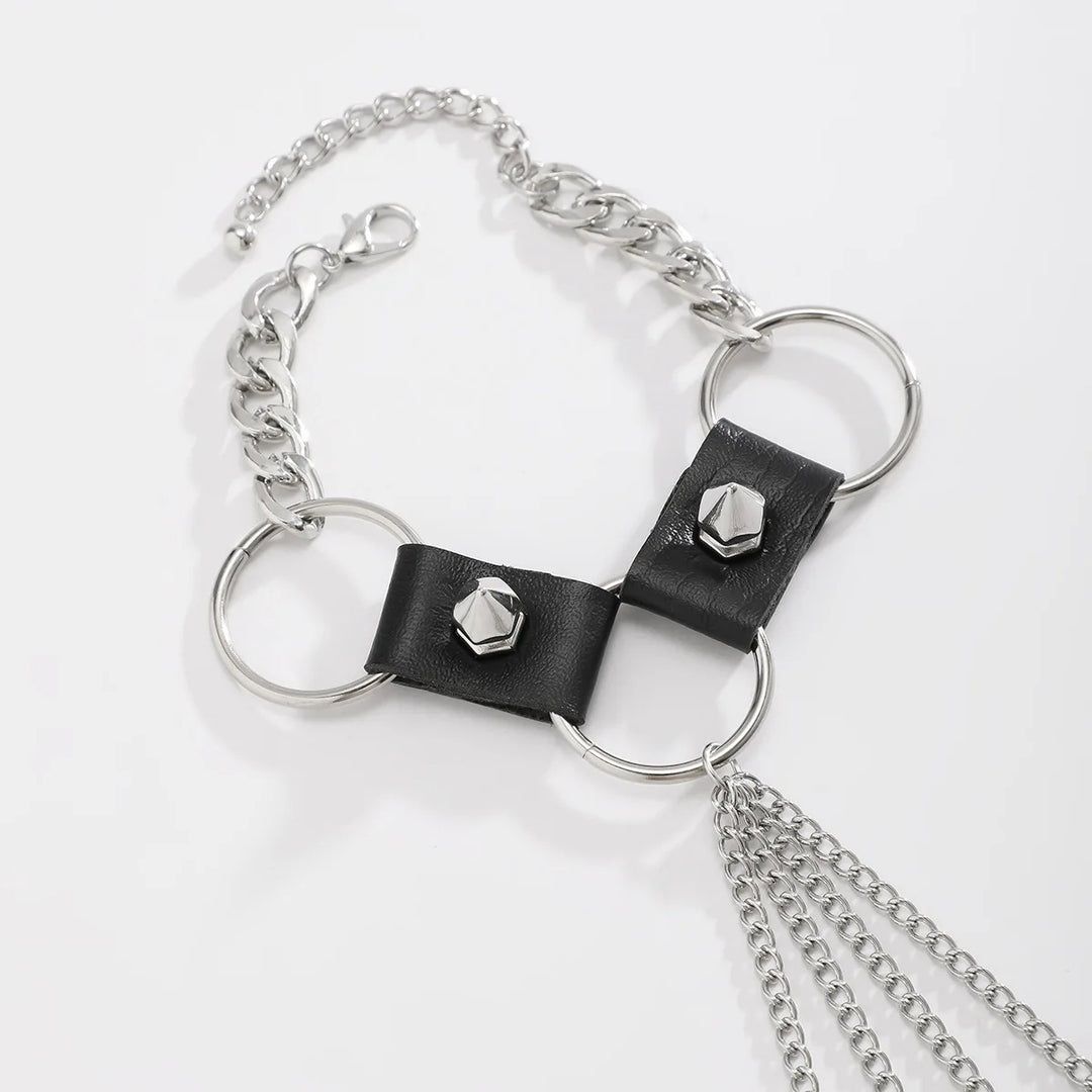 Bracelet with black leather straps and silver chain on a white background
