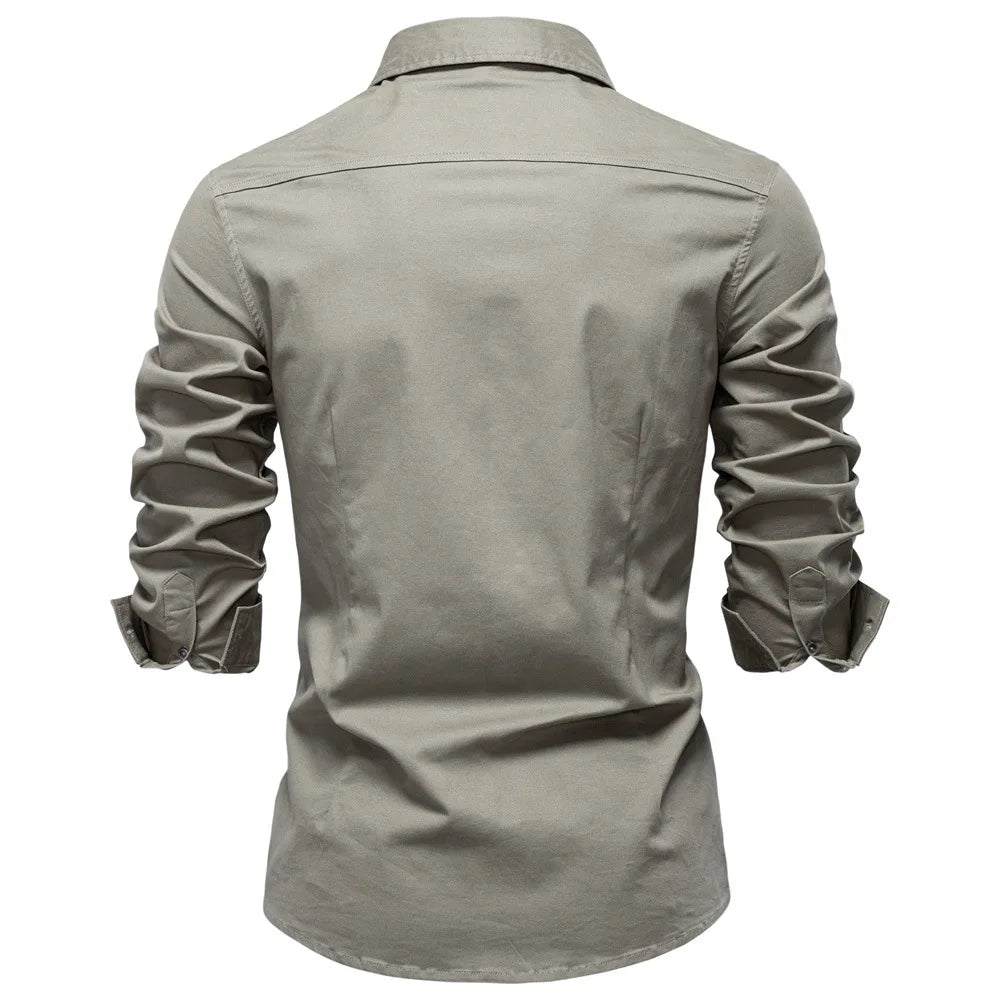 Light gray shirt with rolled-up sleeves on a white background