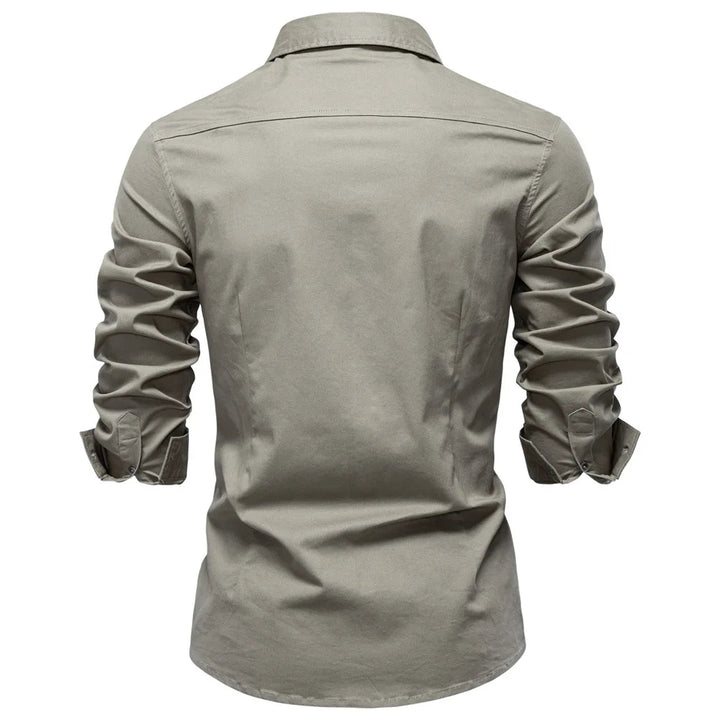 Light gray shirt with rolled-up sleeves on a white background