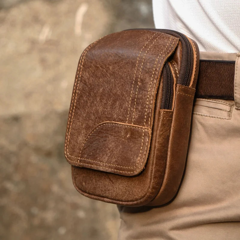 Holt leather waist bag with zipper closure and compact carry shape