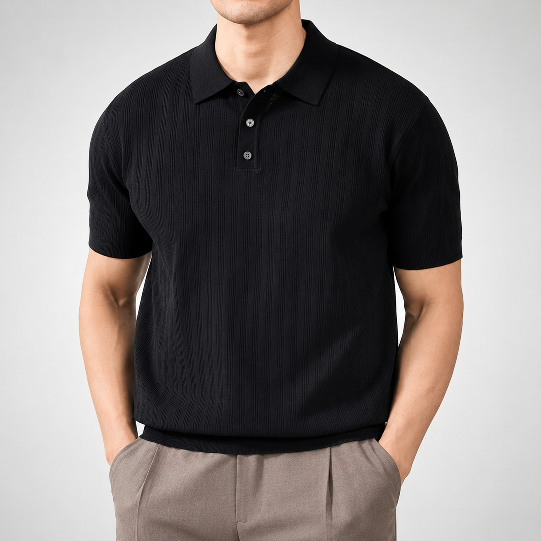 Person wearing a black polo shirt and beige pants on a gray background