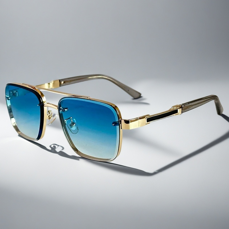 A pair of aviator-style sunglasses with a gold-tone metal frame and gradient lenses.