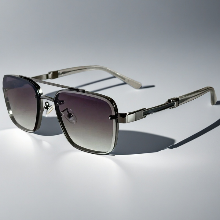 A pair of aviator-style sunglasses with a gold-tone metal frame and gradient lenses.