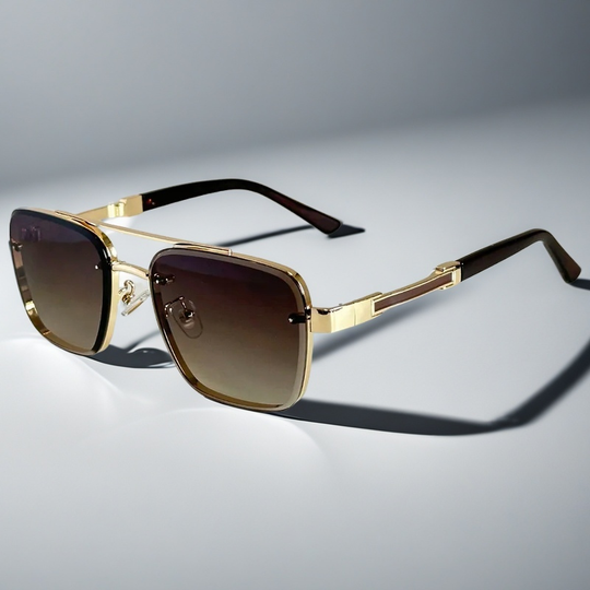 A pair of aviator-style sunglasses with a gold-tone metal frame and gradient lenses.
