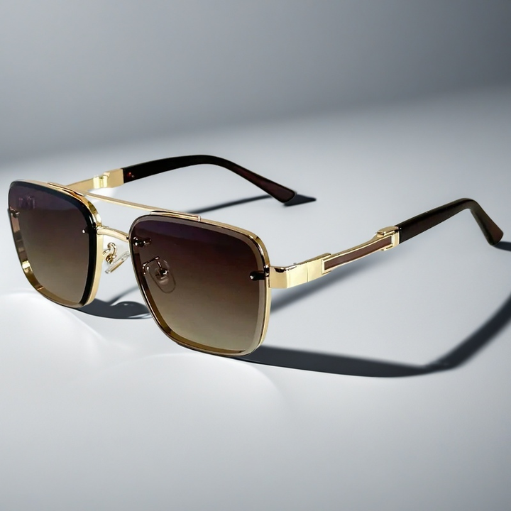 A pair of aviator-style sunglasses with a gold-tone metal frame and gradient lenses.