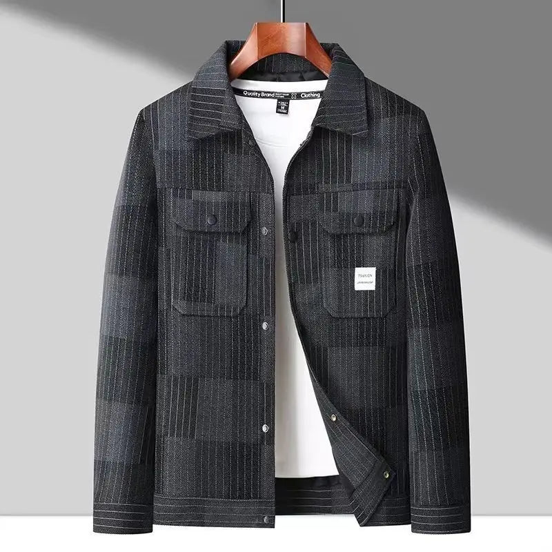 A checkered Montaro Classic Layer Jacket with sleeve pockets, a collar, and subtle stitching, displayed on a wooden hanger.