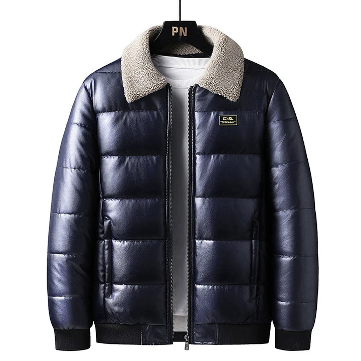 A black hybrid leather thermal jacket with a quilted insulation and a plush sherpa-lined collar. It features ribbed cuffs and hem, and a front zipper closure.