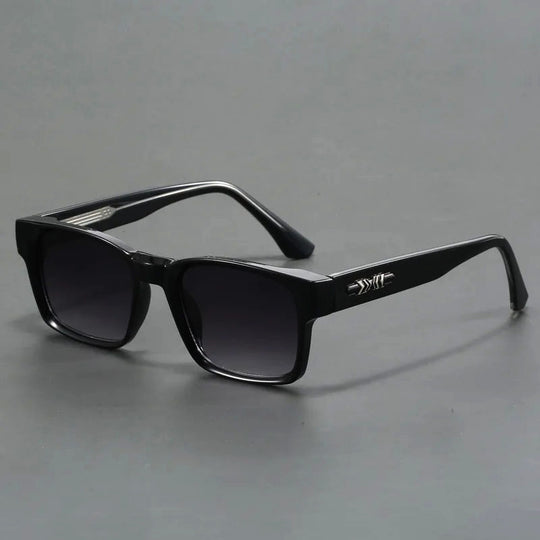 A pair of square-shaped, black acetate sunglasses with tortoiseshell details and UV400 protection.