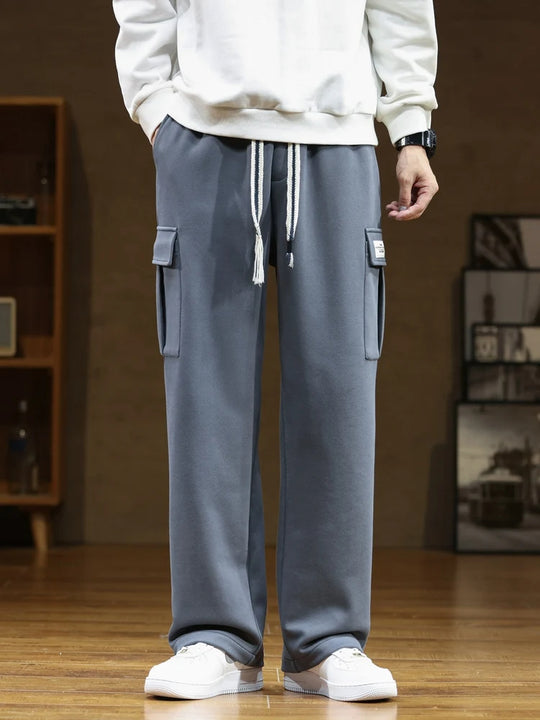 A pair of gray cargo joggers with multiple pockets and an adjustable drawstring waist.