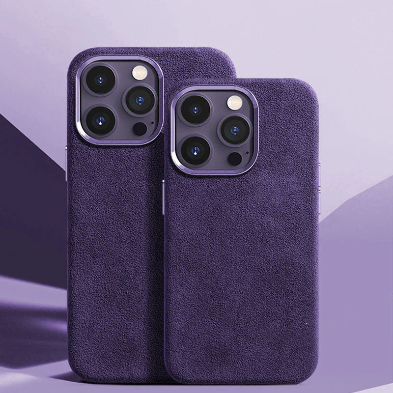 Two phone cases made of suede, one in landscape orientation and one in portrait, both with a metal frame around the camera lens, in a purple color.