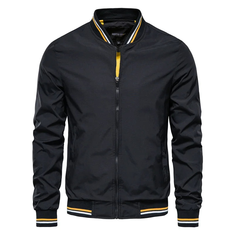 A black Valor Ascend bomber jacket with yellow trim on the collar and cuffs.