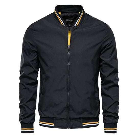 A black Valor Ascend bomber jacket with yellow trim on the collar and cuffs.