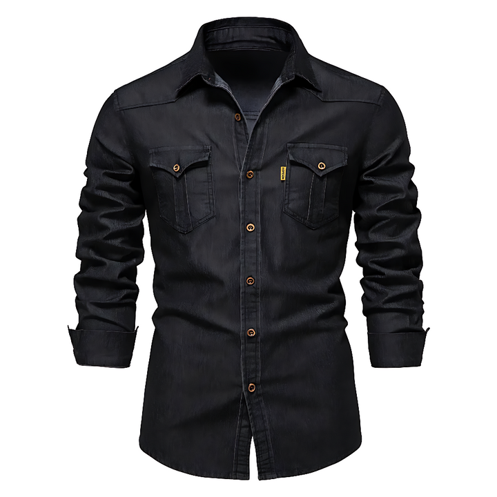 A man wearing a long-sleeved black denim shirt with a collar.